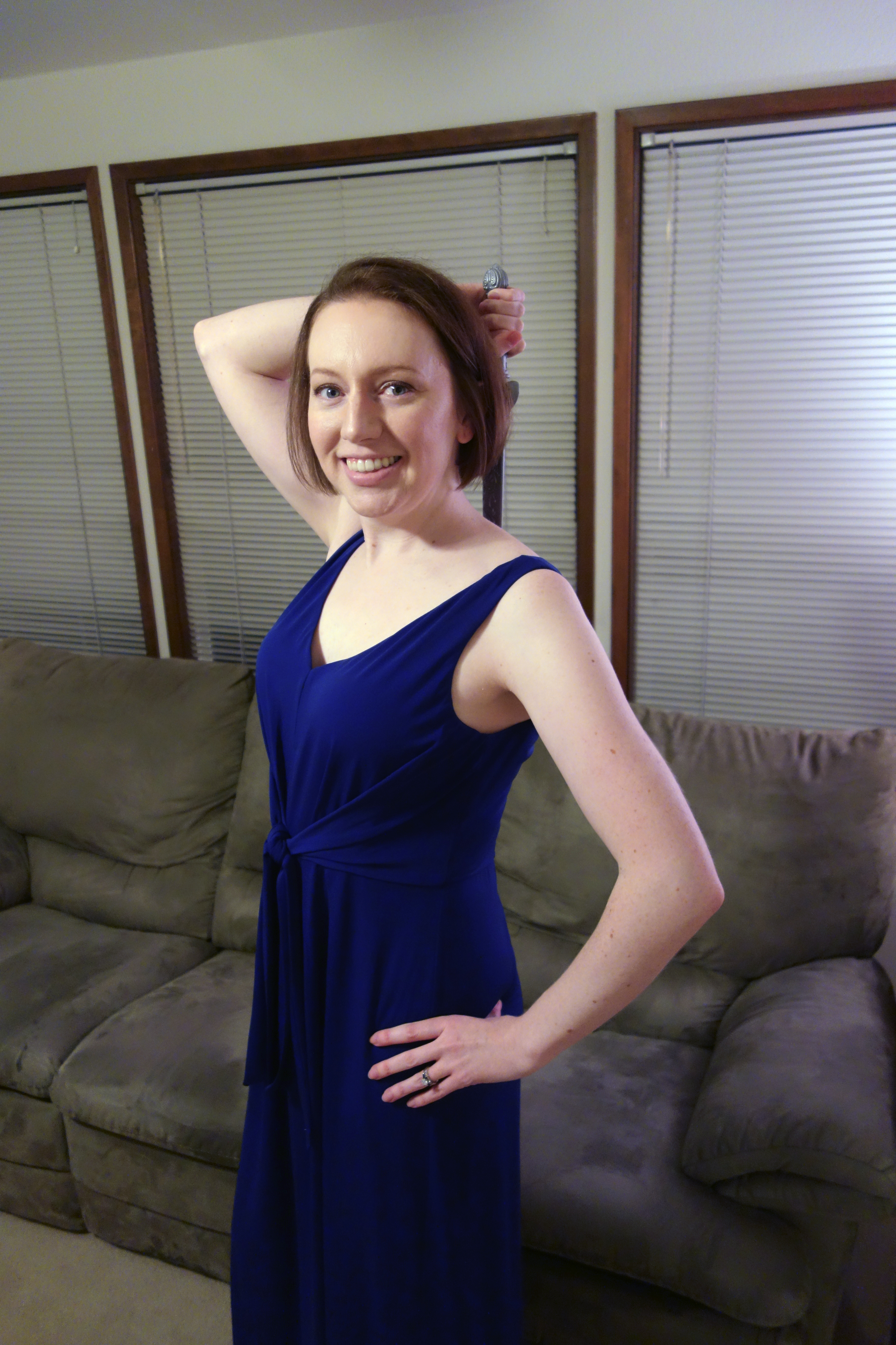 Abigail dressed up as Wonder Woman in her blue dress with sword.